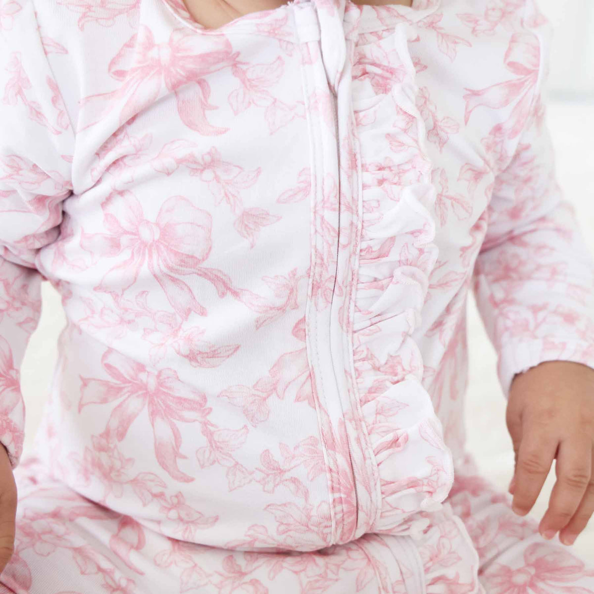 Tutina footie bambina in bamboo-spandex rosa toile con zip e grip