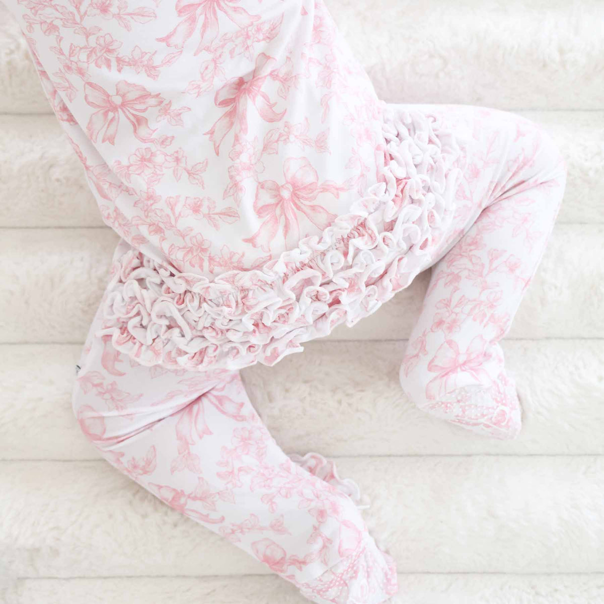 Tutina footie bambina in bamboo-spandex rosa toile con zip e grip