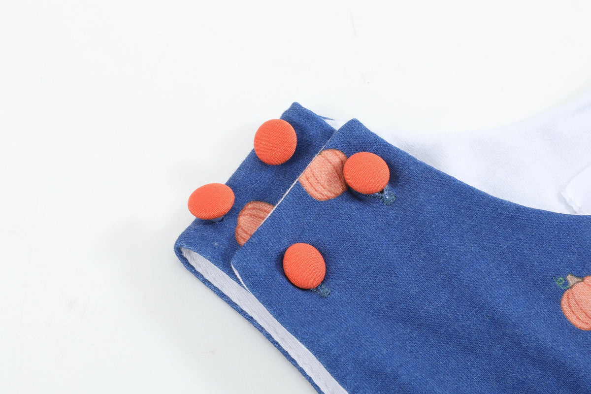 Salopette bimbo in maglia di cotone blu con zucca ricamata
