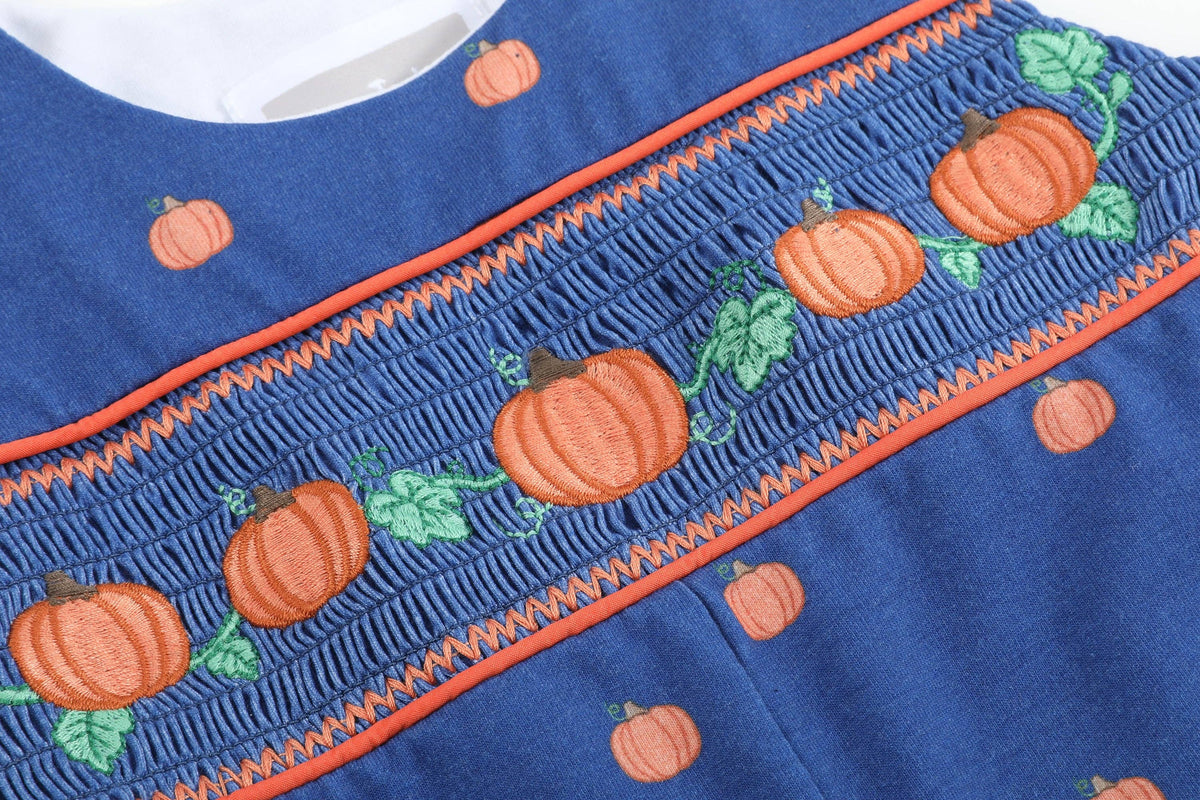 Salopette bimbo in maglia di cotone blu con zucca ricamata