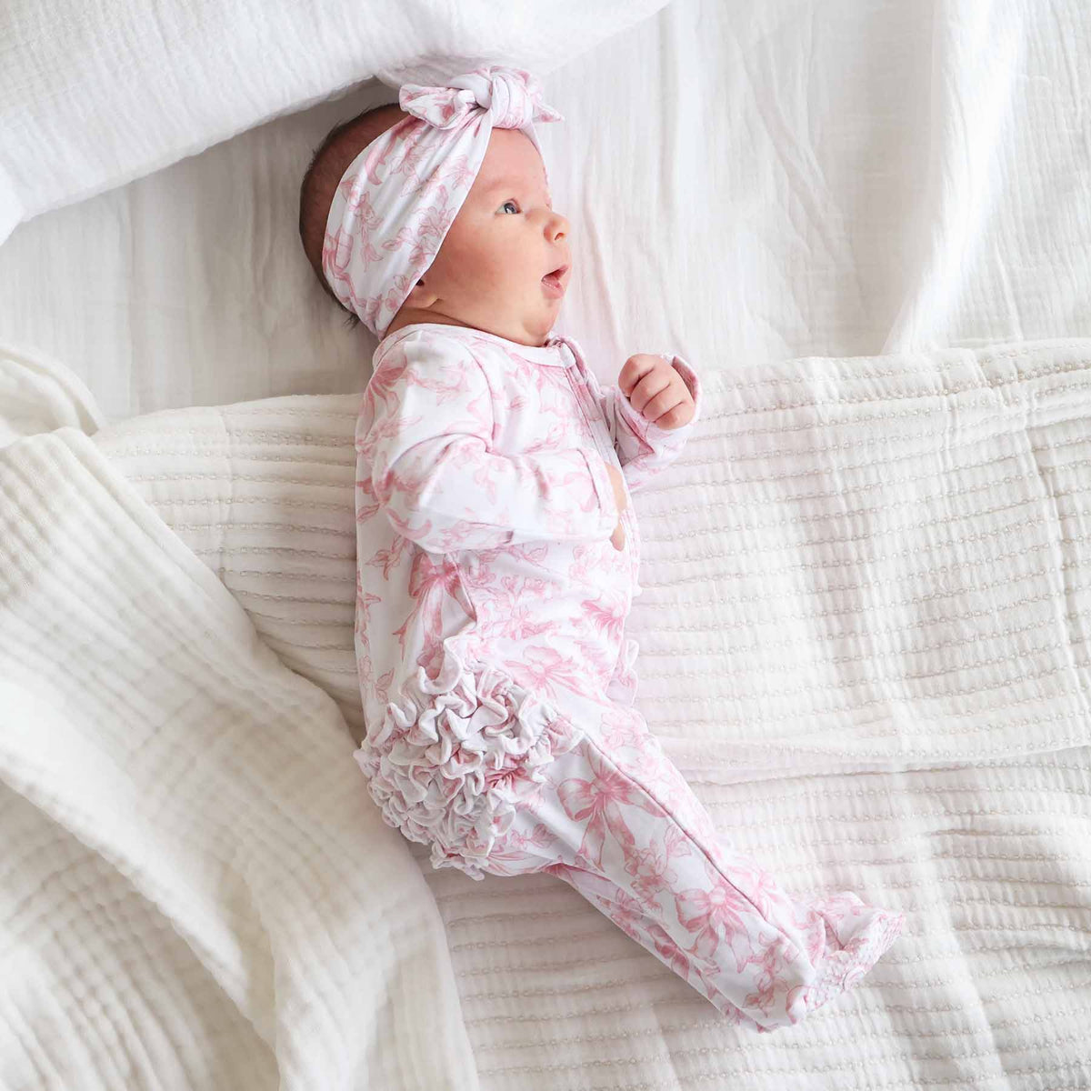 Tutina footie bambina in bamboo-spandex rosa toile con zip e grip