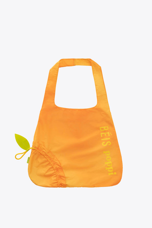 El bolso reutilizable para compras de BÉIS x poppi en color Mango