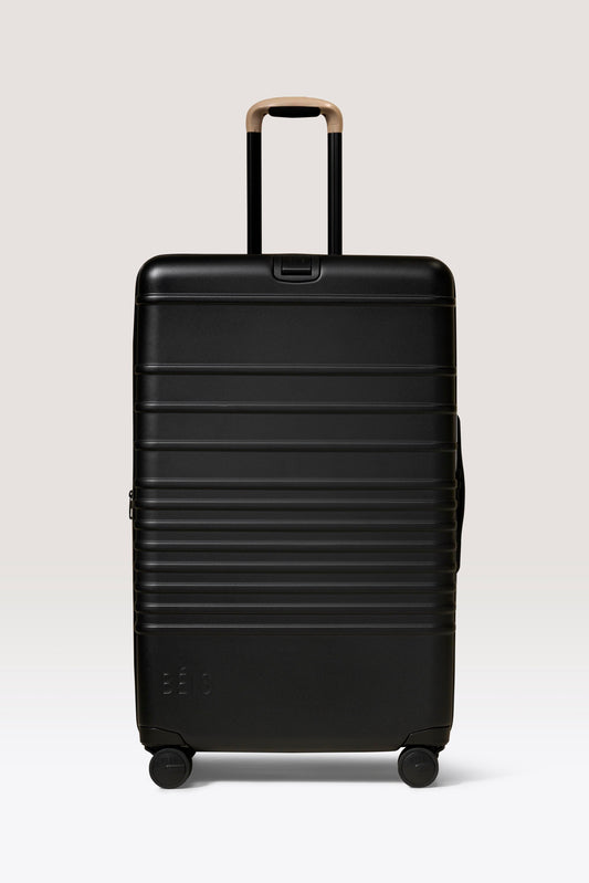 La valise à roulettes grand format en noir