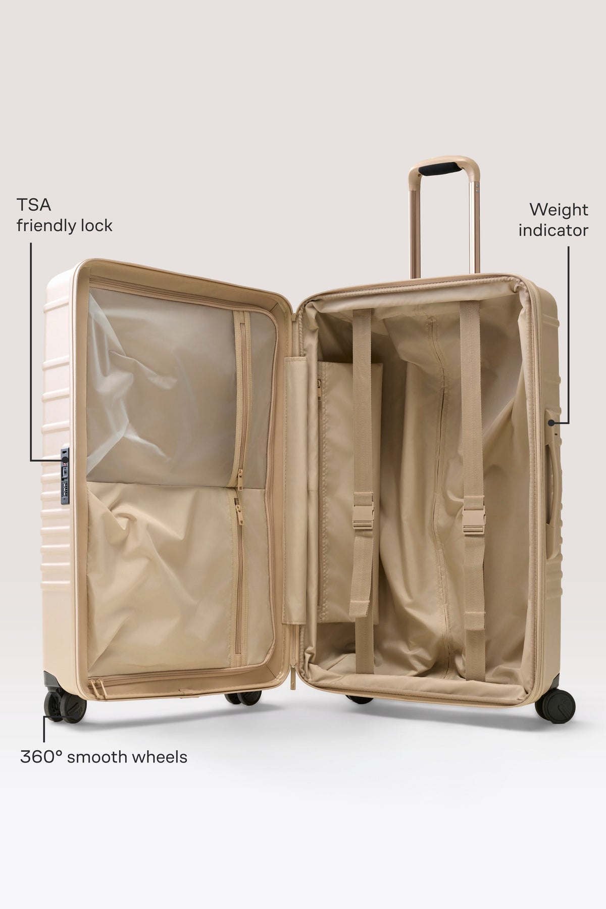 La grande valise à roulettes beige