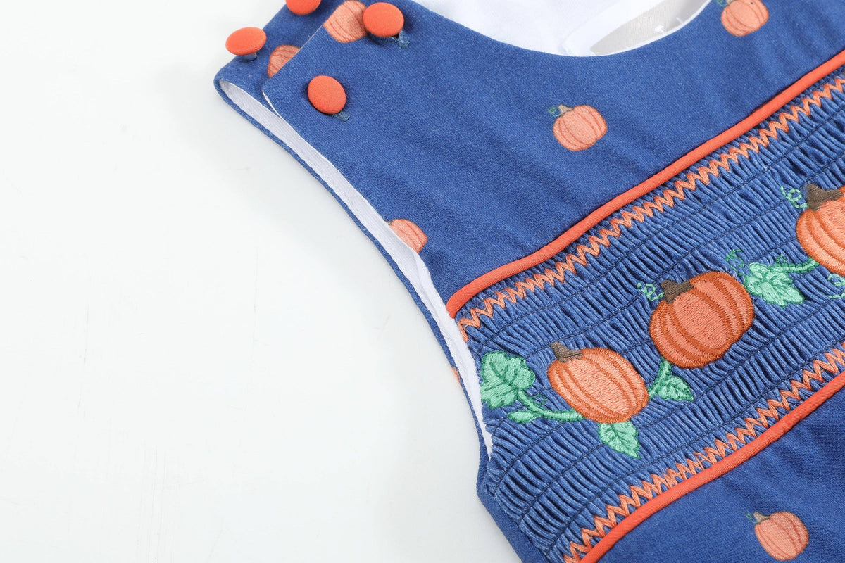 Salopette bimbo in maglia di cotone blu con zucca ricamata